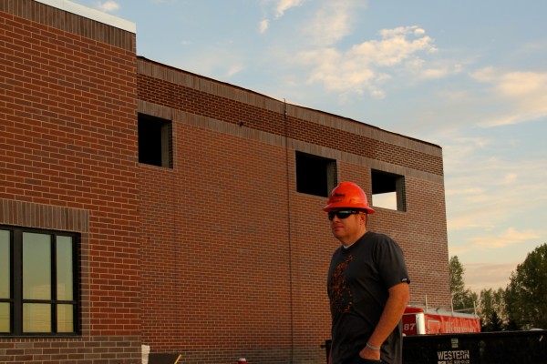 Mr. Perkins in front of auxiliary gyms Mr. Perkins in front of auxiliary gyms